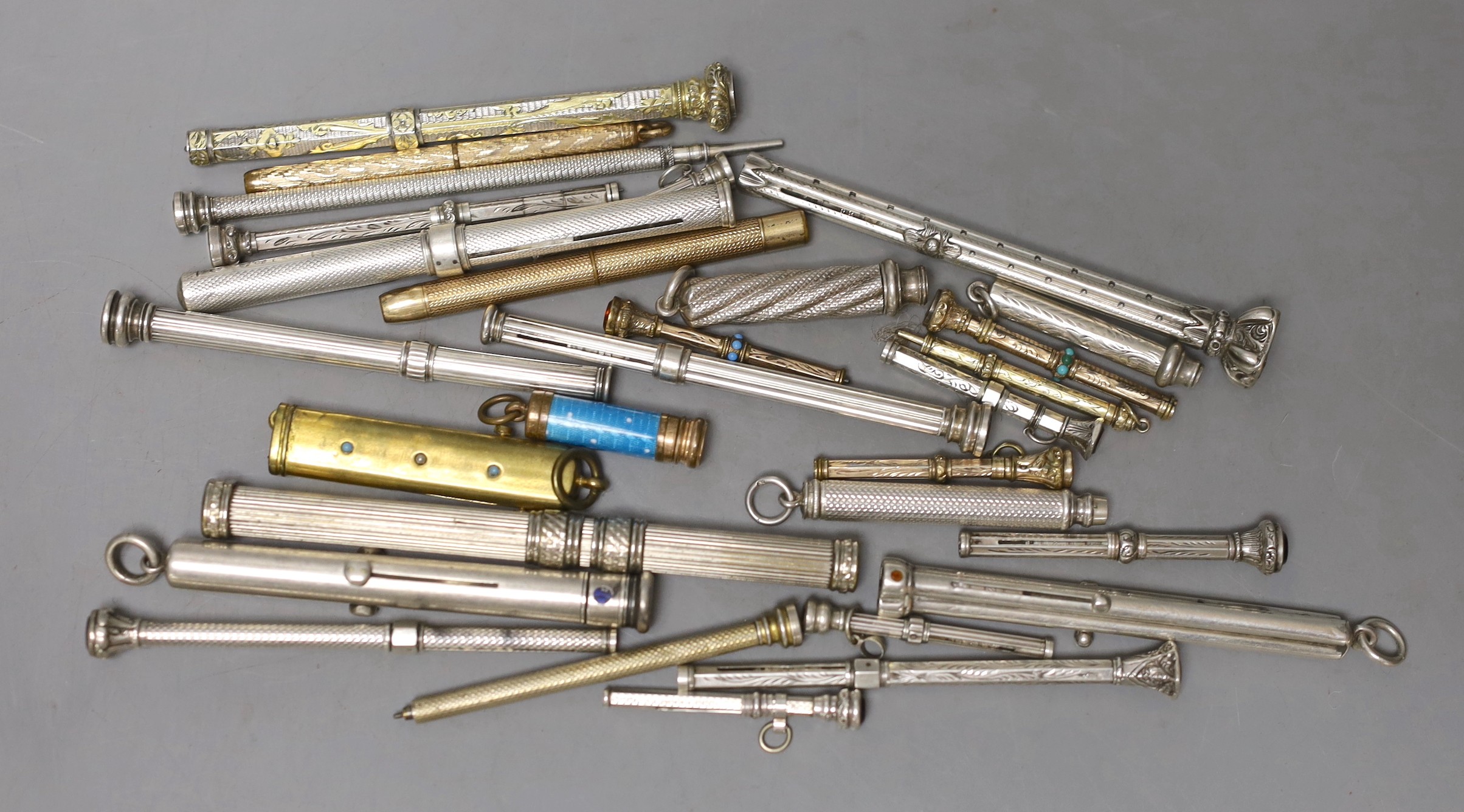 A collection of assorted white and base metal propelling pencils, etc.